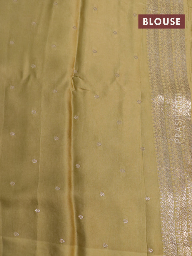 Mushru silk saree mustard shade with allover self emboss and zari woven butta border