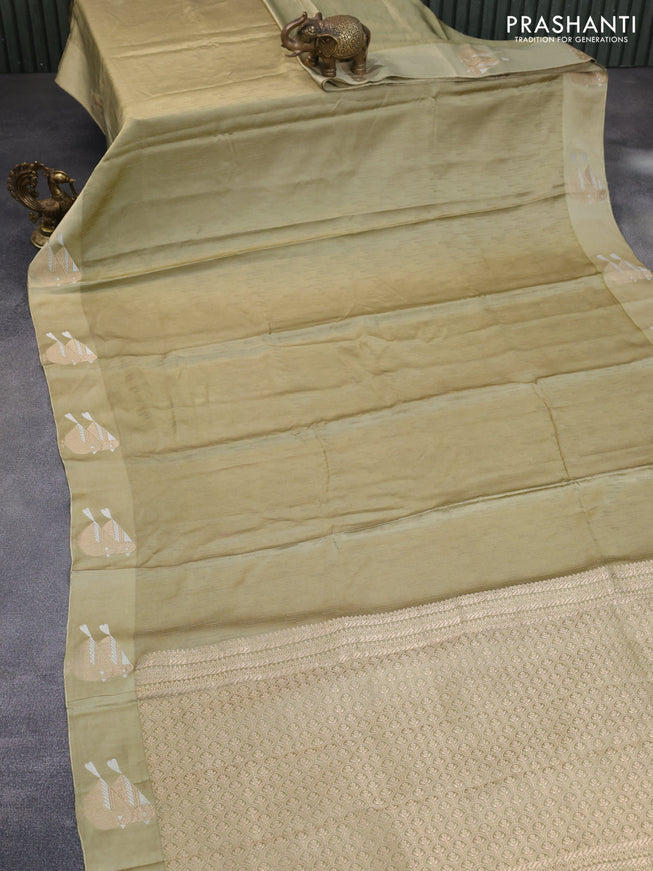 Mushru silk saree pastel green with allover self emboss and zari woven butta border