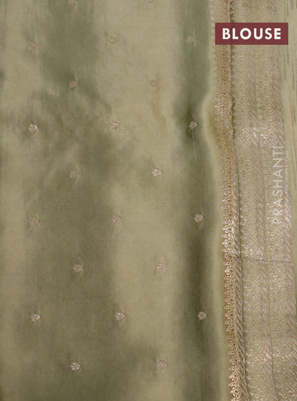 Mushru silk saree pastel green with allover self emboss and zari woven butta border