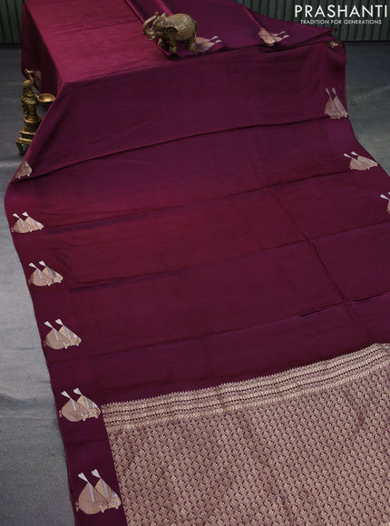 Mushru silk saree wine shade with allover self emboss and zari woven butta border