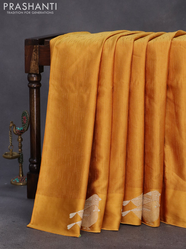 Mushru silk saree mustard yellow with allover self emboss and zari woven butta border