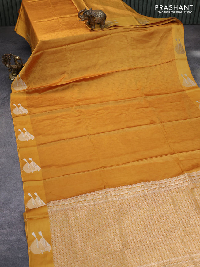 Mushru silk saree mustard yellow with allover self emboss and zari woven butta border