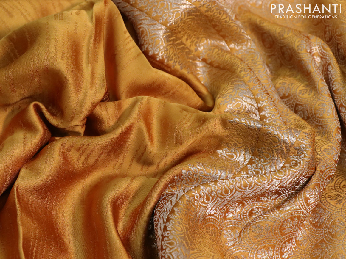 Mushru silk saree mustard yellow with allover self emboss and zari woven butta border