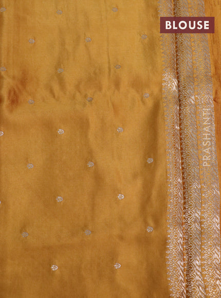 Mushru silk saree mustard yellow with allover self emboss and zari woven butta border