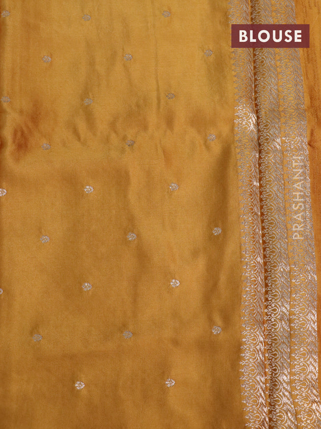 Mushru silk saree mustard yellow with allover self emboss and zari woven butta border