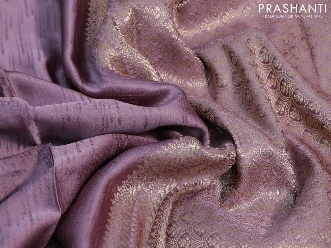 Mushru silk saree pastel purple with allover self emboss and zari woven butta border