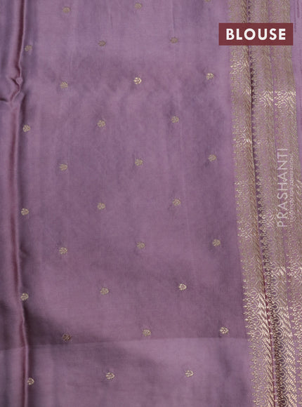 Mushru silk saree pastel purple with allover self emboss and zari woven butta border