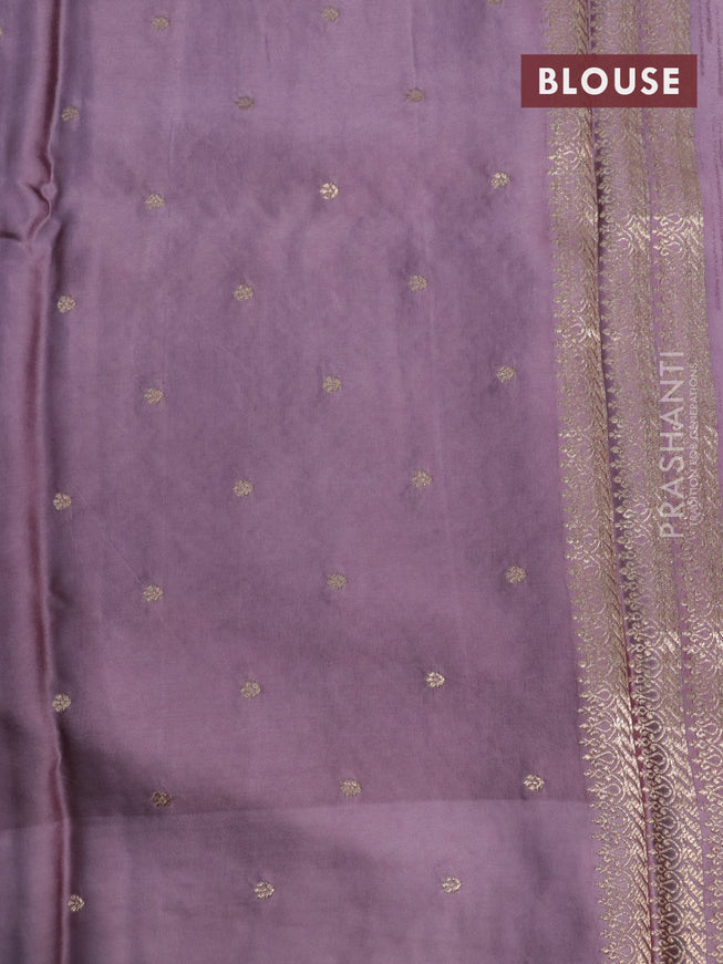 Mushru silk saree pastel purple with allover self emboss and zari woven butta border