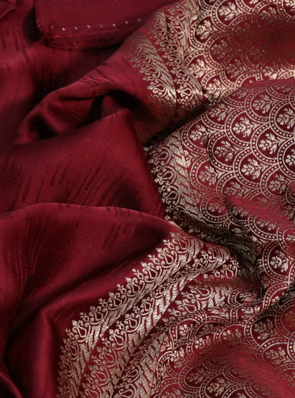 Mushru silk saree maroon with allover self emboss and zari woven butta border