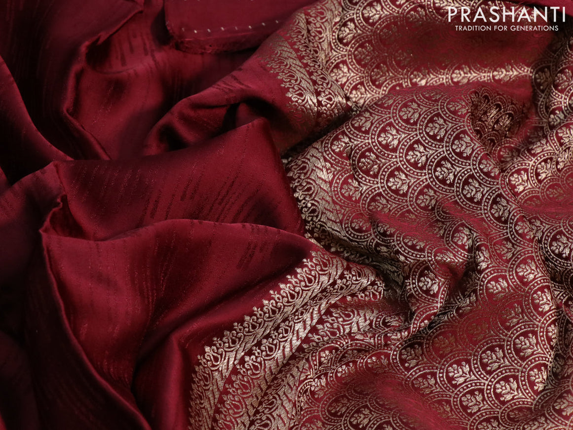 Mushru silk saree maroon with allover self emboss and zari woven butta border