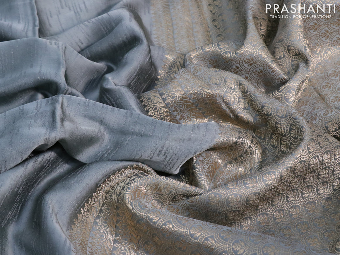 Mushru silk saree grey with allover self emboss and zari woven butta border