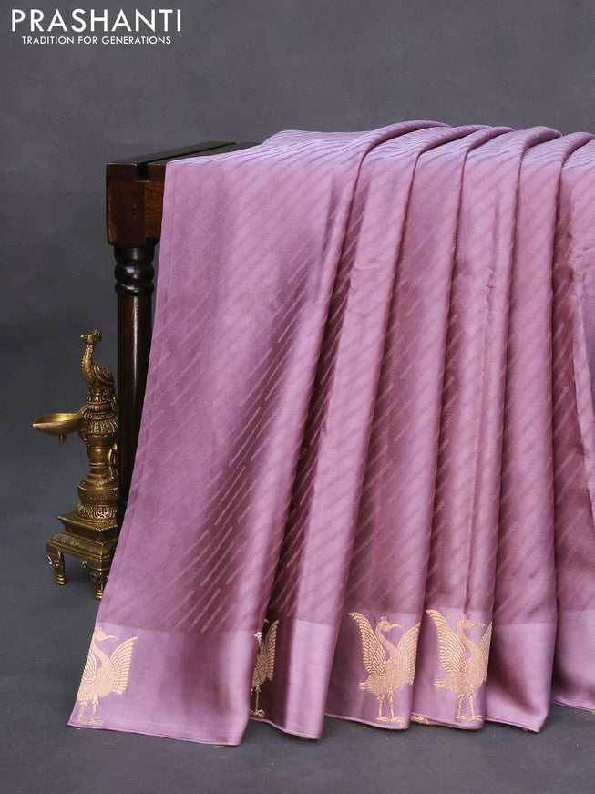 Mushru silk saree pastel purple with allover self emboss and zari woven butta border