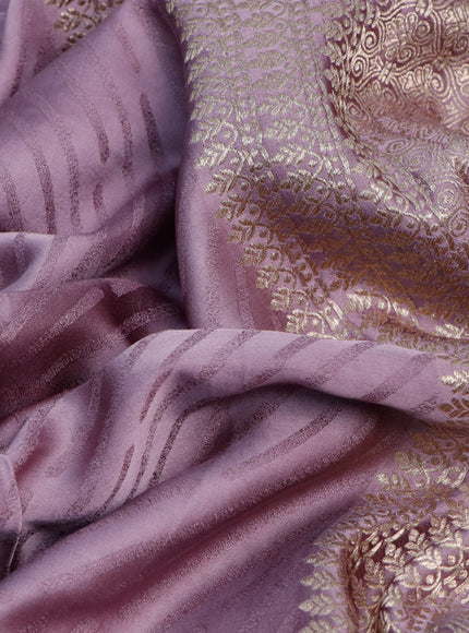 Mushru silk saree pastel purple with allover self emboss and zari woven butta border