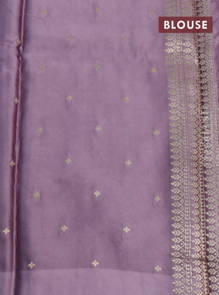 Mushru silk saree pastel purple with allover self emboss and zari woven butta border