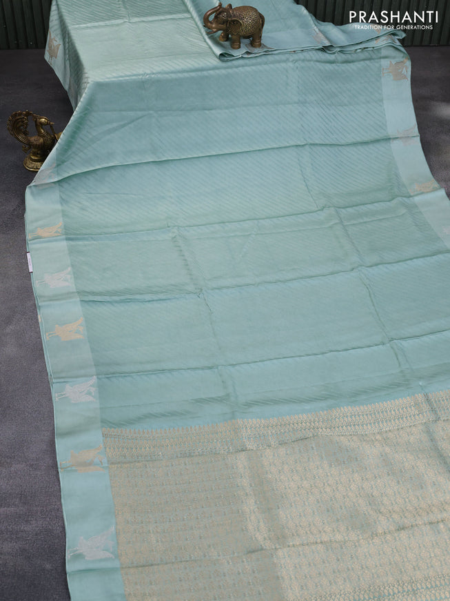 Mushru silk saree pastel blue with allover self emboss and zari woven butta border