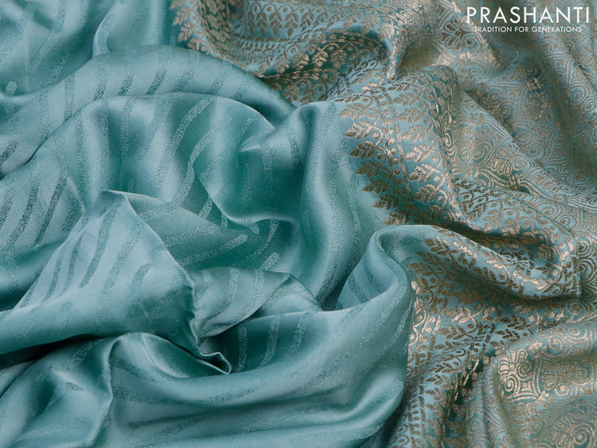 Mushru silk saree pastel blue with allover self emboss and zari woven butta border