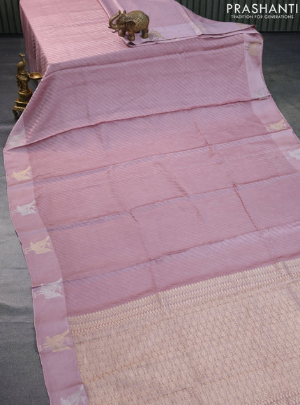 Mushru silk saree pastel pink with allover self emboss and zari woven butta border