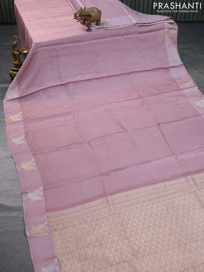 Mushru silk saree pastel pink with allover self emboss and zari woven butta border