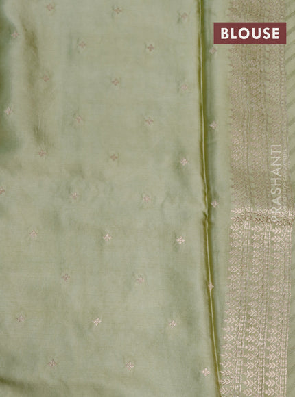 Mushru silk saree pastel green with allover self emboss and zari woven butta border