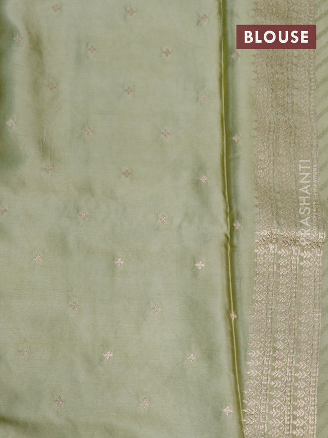 Mushru silk saree pastel green with allover self emboss and zari woven butta border