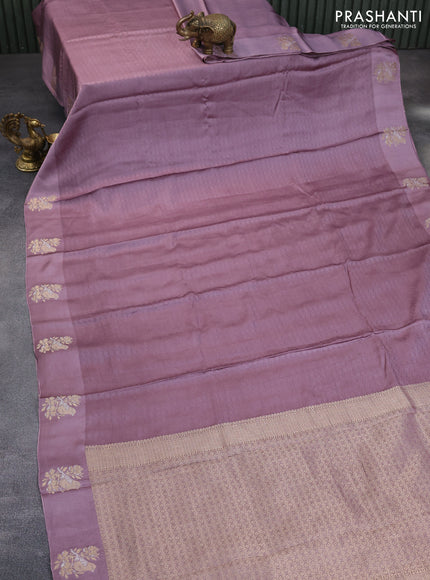 Mushru silk saree pastel purple with allover self emboss and zari woven butta border