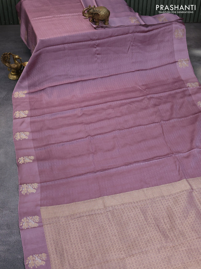 Mushru silk saree pastel purple with allover self emboss and zari woven butta border