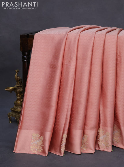 Mushru silk saree pastel peach with allover self emboss and zari woven butta border