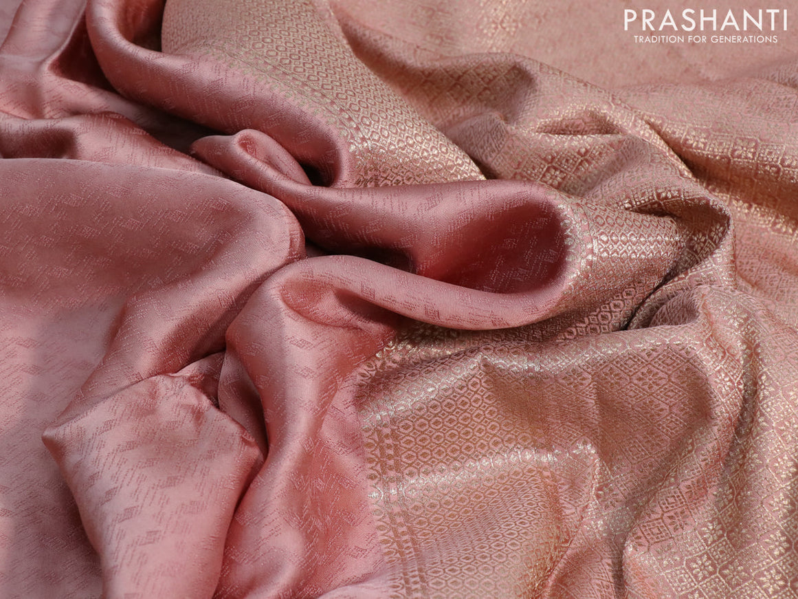 Mushru silk saree pastel peach with allover self emboss and zari woven butta border