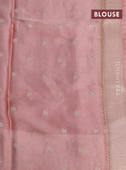 Mushru silk saree pastel peach with allover self emboss and zari woven butta border