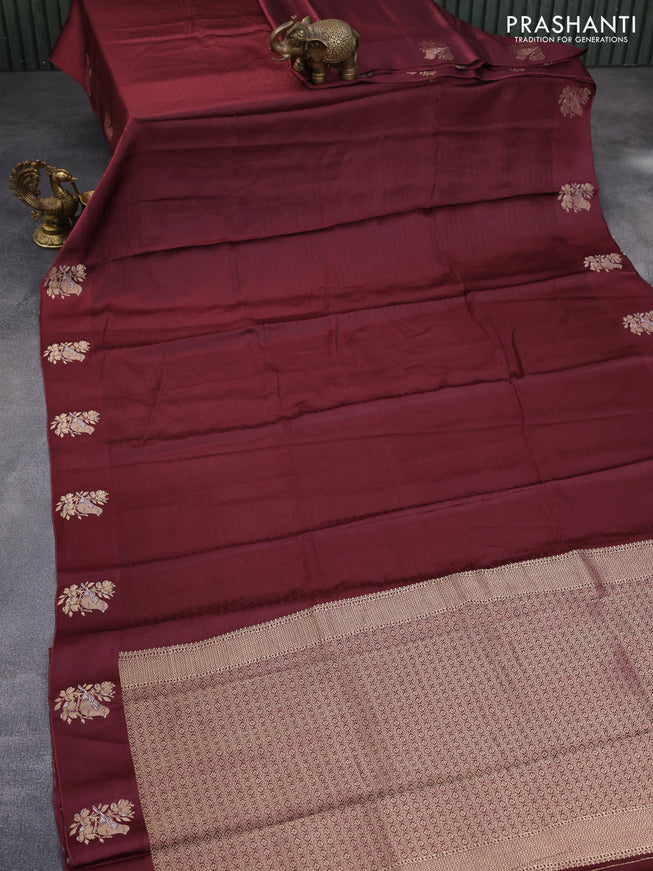 Mushru silk saree deep maroon with allover self emboss and zari woven butta border