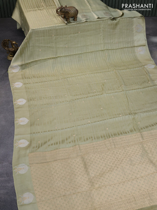 Mushru silk saree pastel green with allover self emboss & zari buttas and zari woven butta border