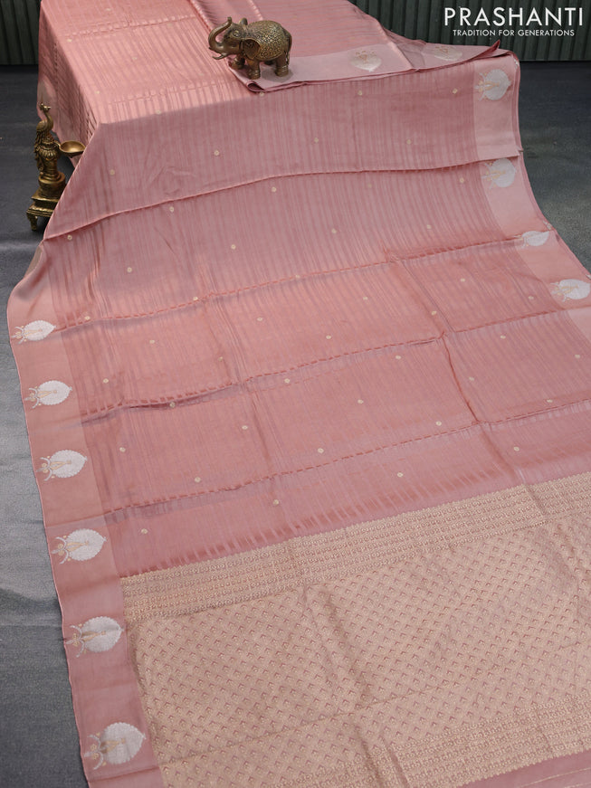 Mushru silk saree pastel peach with allover self emboss & zari buttas and zari woven butta border