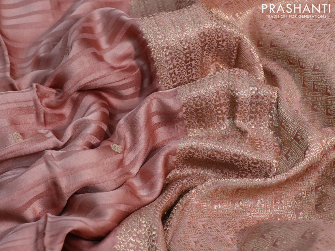 Mushru silk saree pastel peach with allover self emboss & zari buttas and zari woven butta border