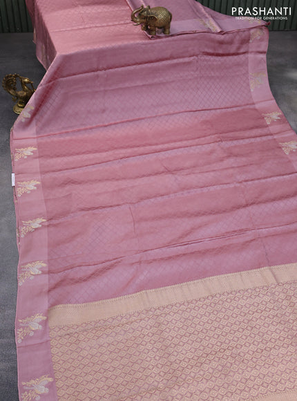 Mushru silk saree pastel pink with allover self emboss and zari woven butta border