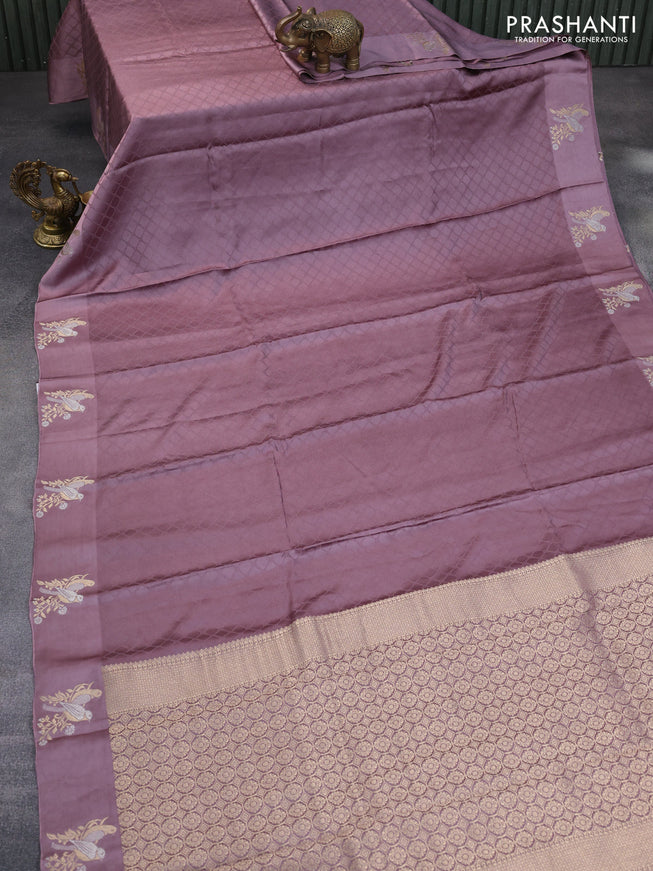 Mushru silk saree pastel purple with allover self emboss and zari woven butta border