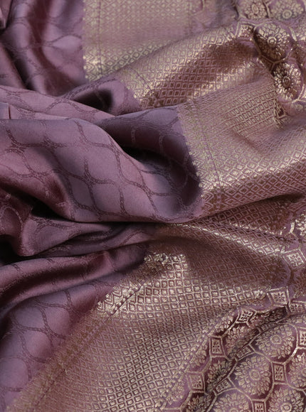 Mushru silk saree pastel purple with allover self emboss and zari woven butta border