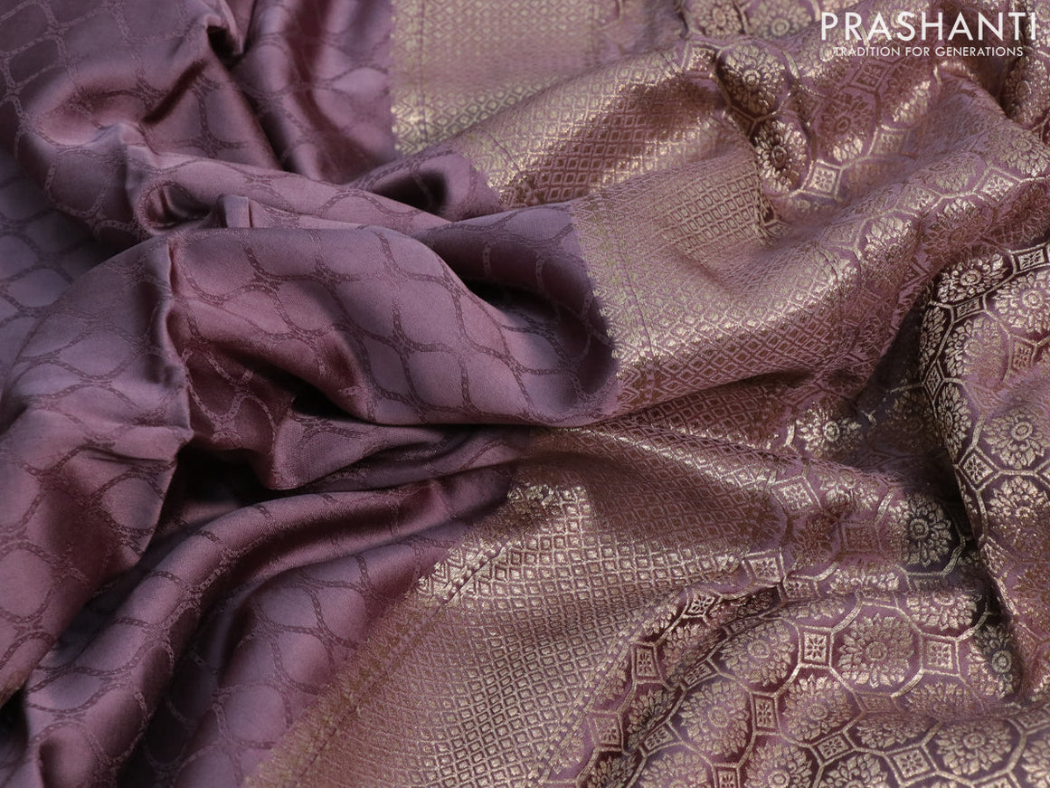 Mushru silk saree pastel purple with allover self emboss and zari woven butta border