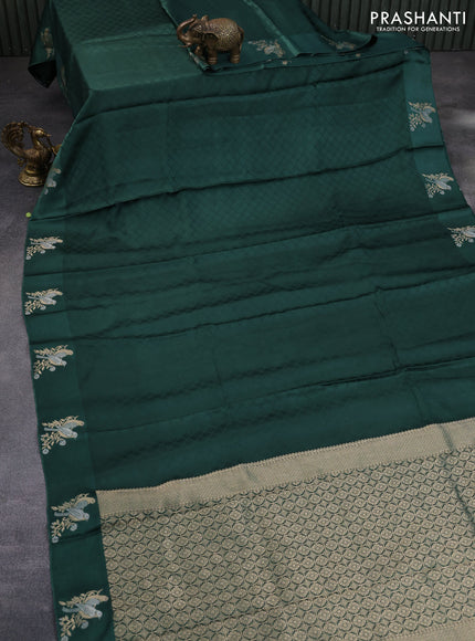 Mushru silk saree green with allover self emboss and zari woven butta border