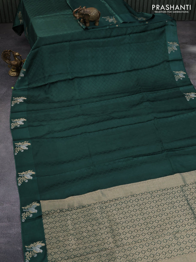 Mushru silk saree green with allover self emboss and zari woven butta border