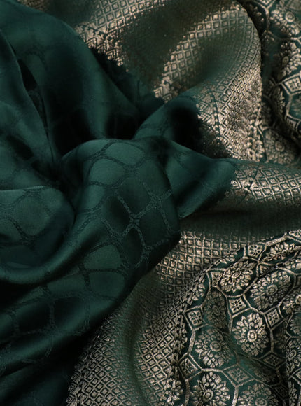 Mushru silk saree green with allover self emboss and zari woven butta border