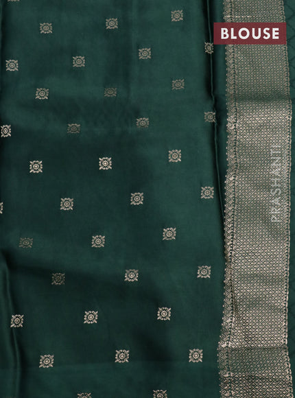 Mushru silk saree green with allover self emboss and zari woven butta border