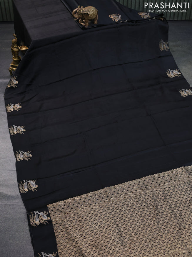 Mushru silk saree black with allover self emboss and zari woven butta border