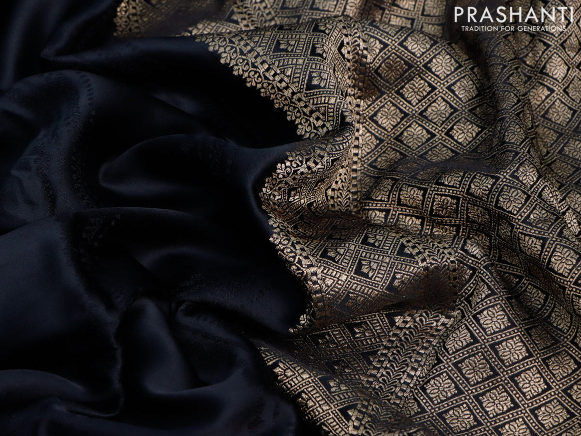 Mushru silk saree black with allover self emboss and zari woven butta border