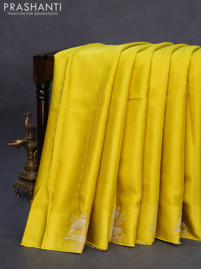 Mushru silk saree lime yellow with allover self emboss and zari woven butta border