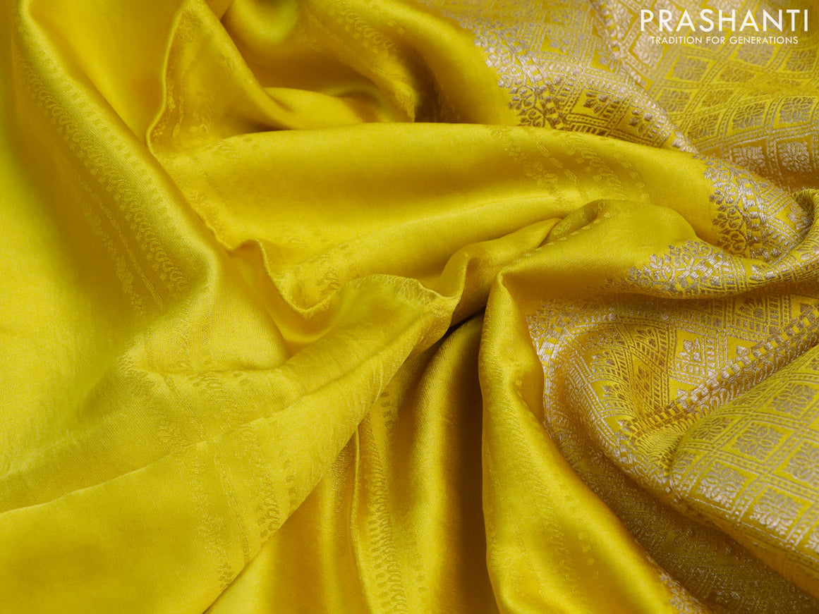 Mushru silk saree lime yellow with allover self emboss and zari woven butta border