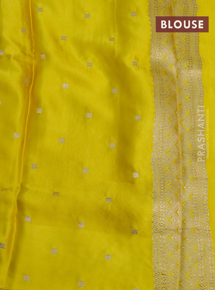 Mushru silk saree lime yellow with allover self emboss and zari woven butta border