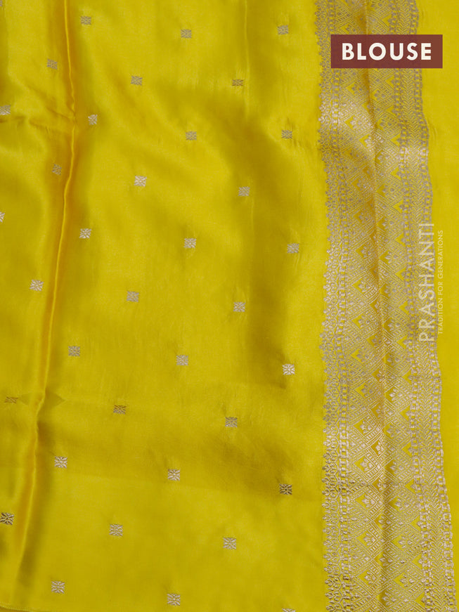 Mushru silk saree lime yellow with allover self emboss and zari woven butta border