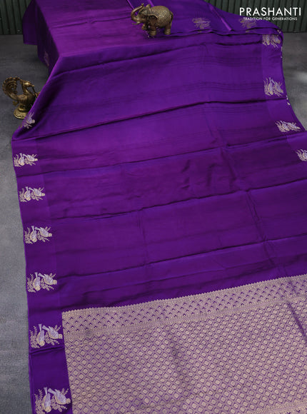 Mushru silk saree violet with allover self emboss and zari woven butta border