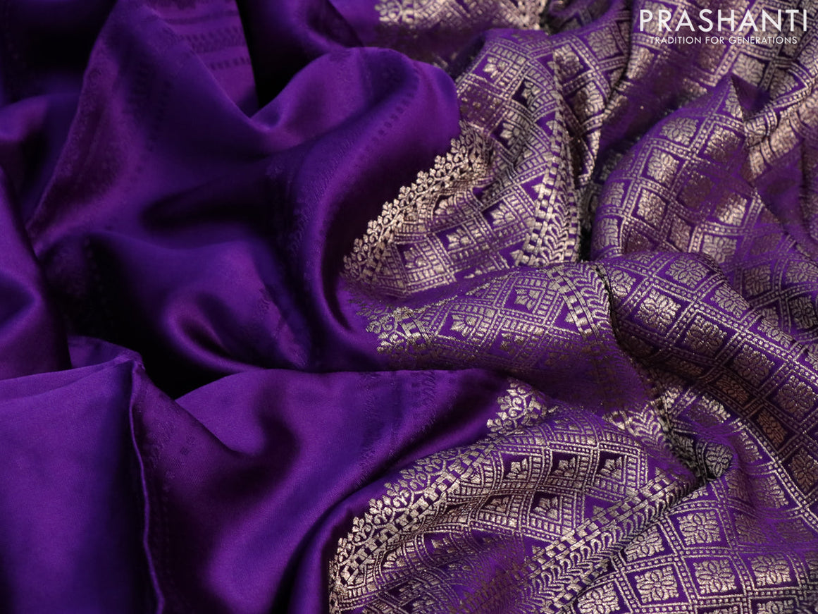 Mushru silk saree violet with allover self emboss and zari woven butta border