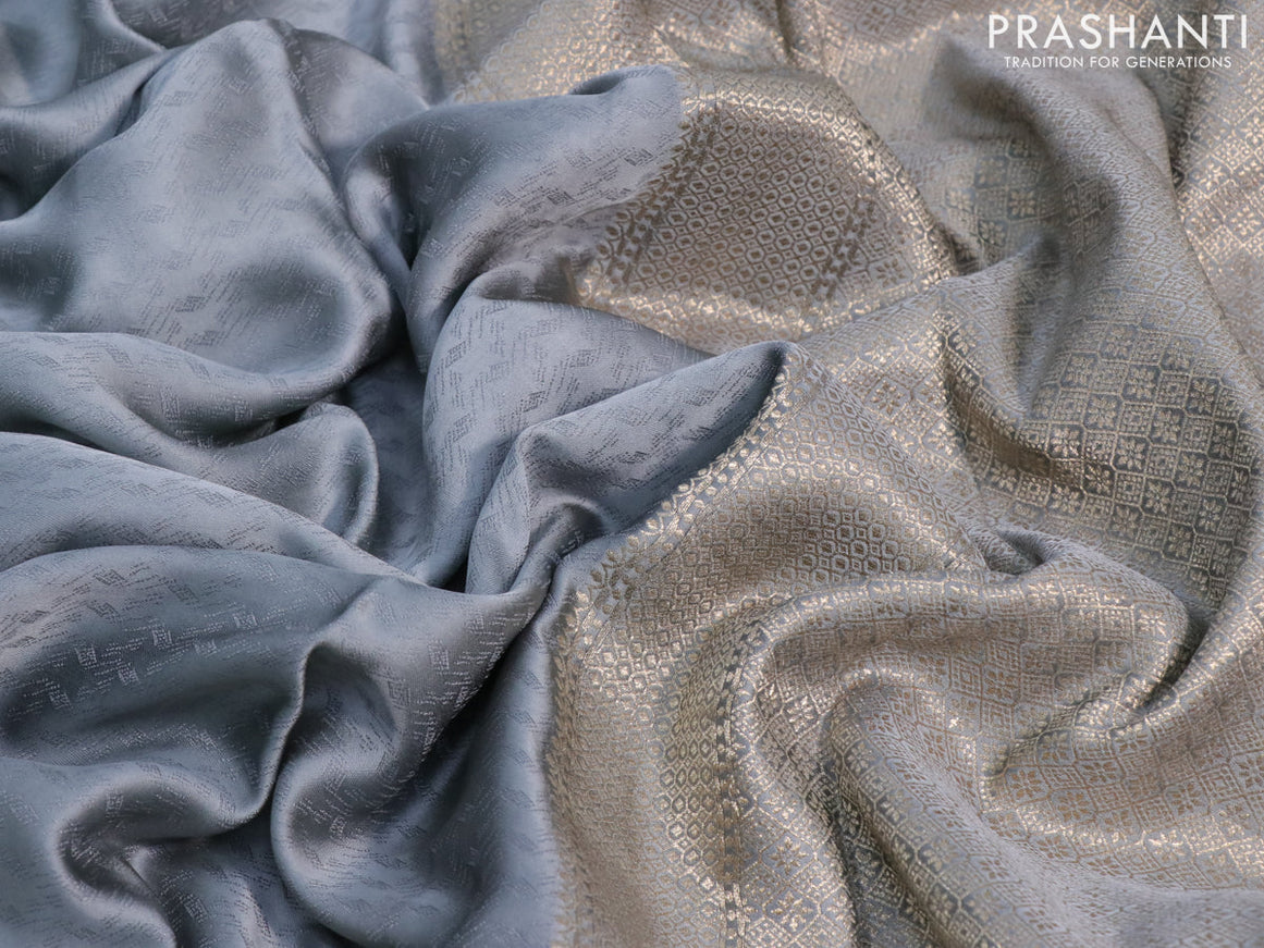 Mushru silk saree grey with allover self emboss and zari woven butta border